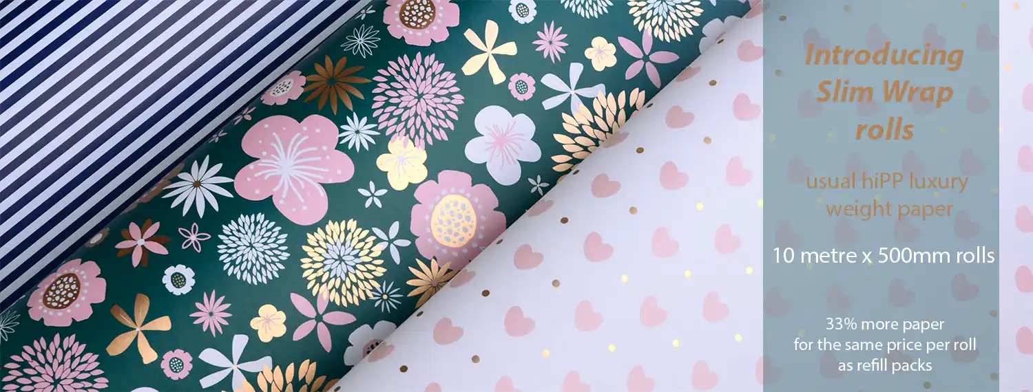 Three slim wrapping paper rolls showing different designs available