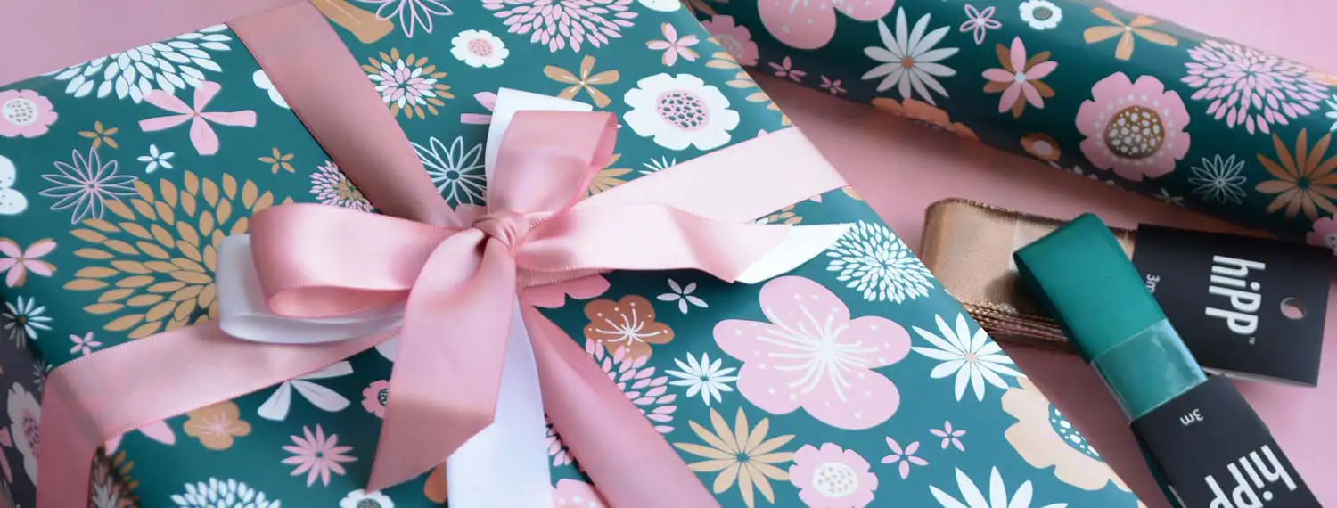 roll of hiPP wrapping paper with a coordinating ribbon