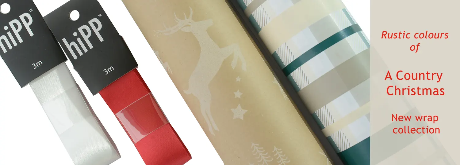 A Country Christmas wrapping paper collection with contrasting white and red satin ribbons
